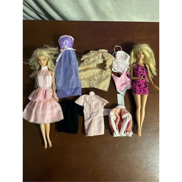 2 vintage Barbie’s with 9 outfits